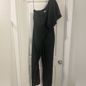 Venus, black one shoulder jumpsuit.